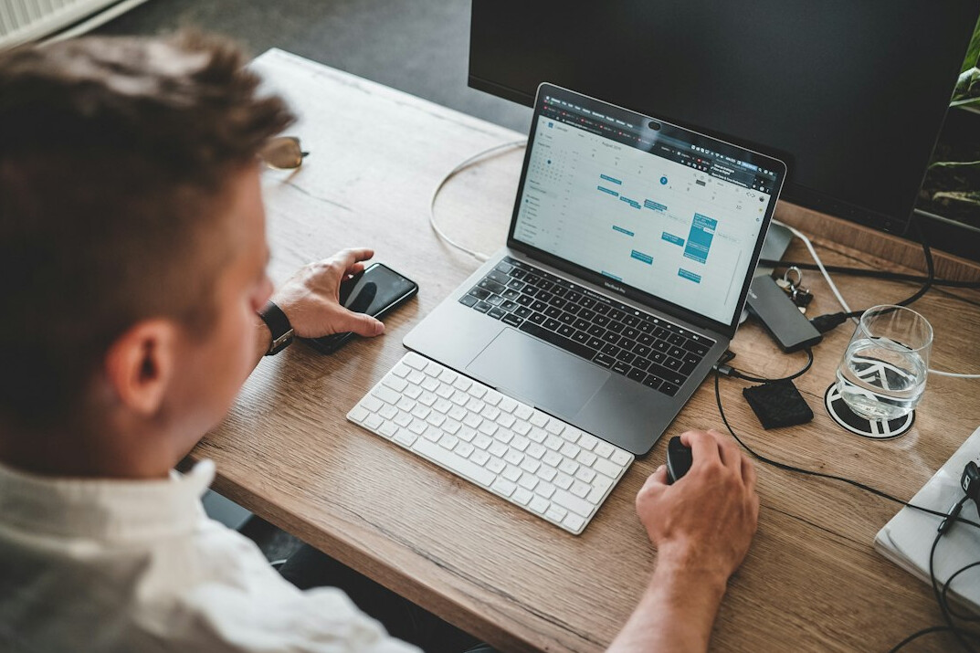 woman coding on computer at home