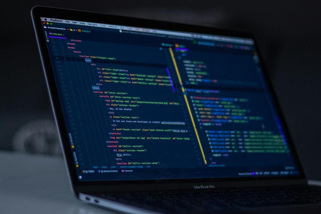 laptop with code on screen