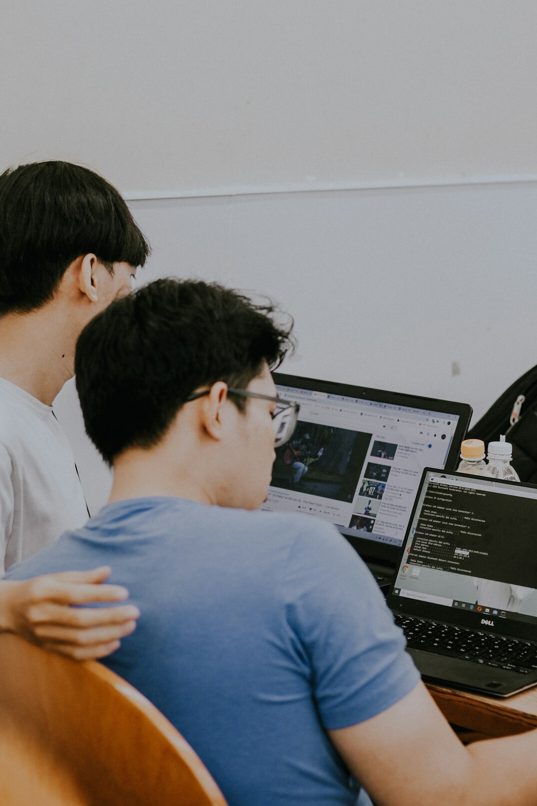 kids coding on laptops